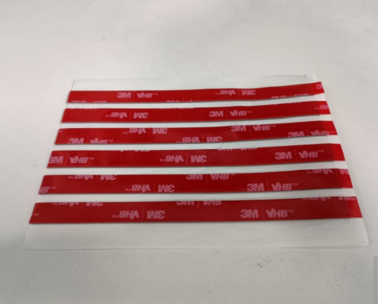 Red adhesive strip samples